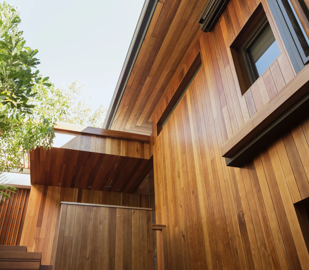 Modern home design featuring wooden siding