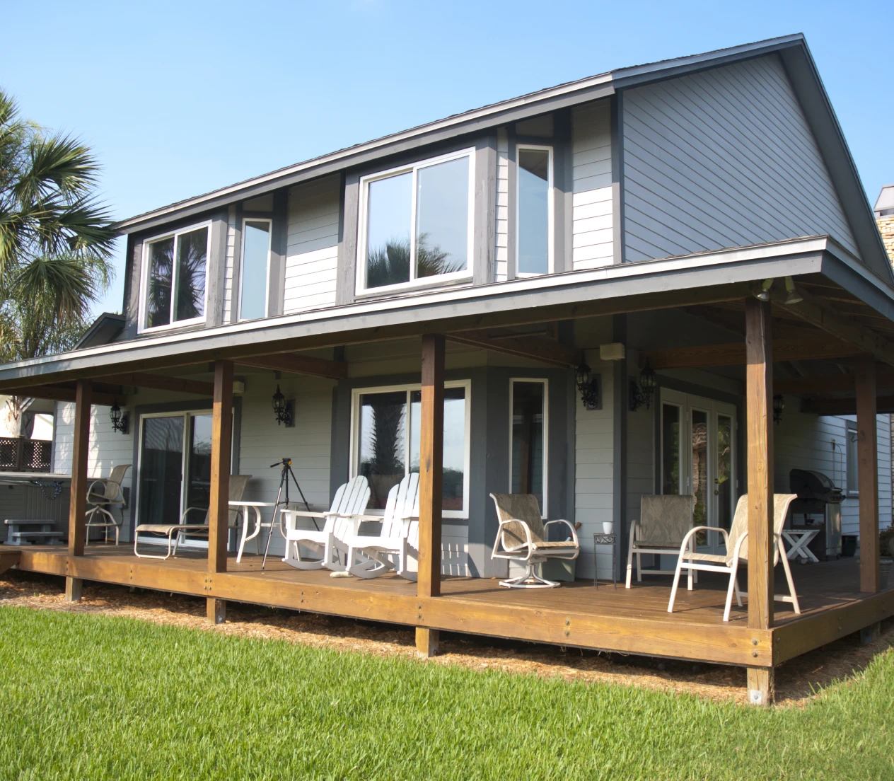 Spacious wooden deck with patio chairs