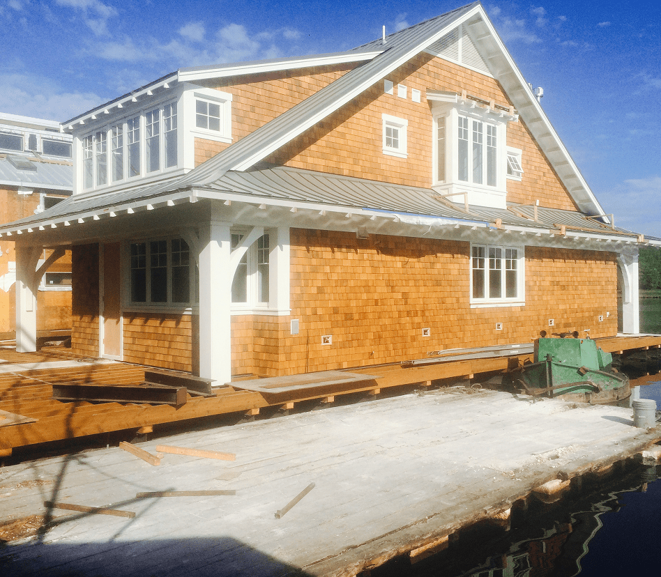 Coastal home under construction by the water